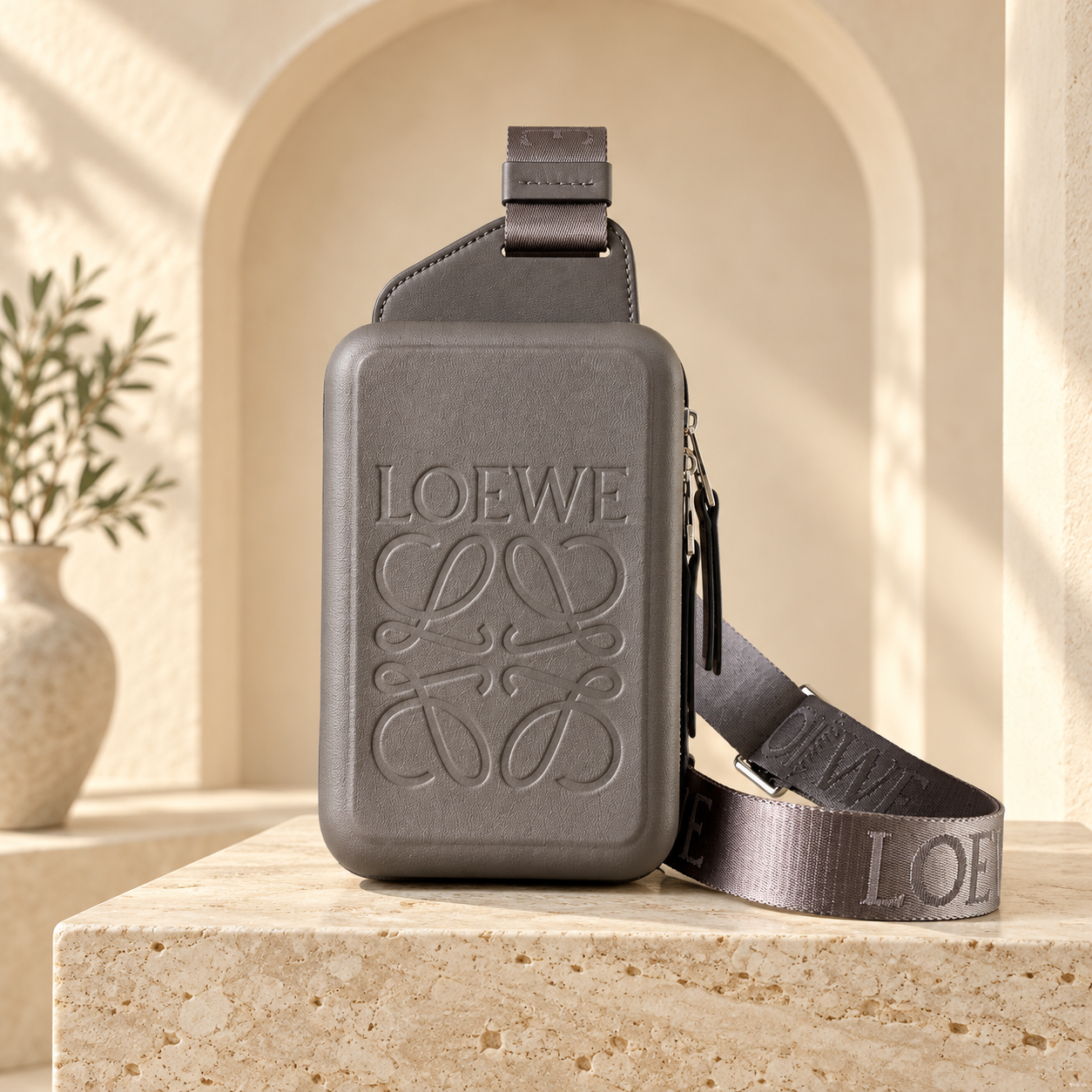 Loewe Molded Sling Bag in dark grey, straight-on front view